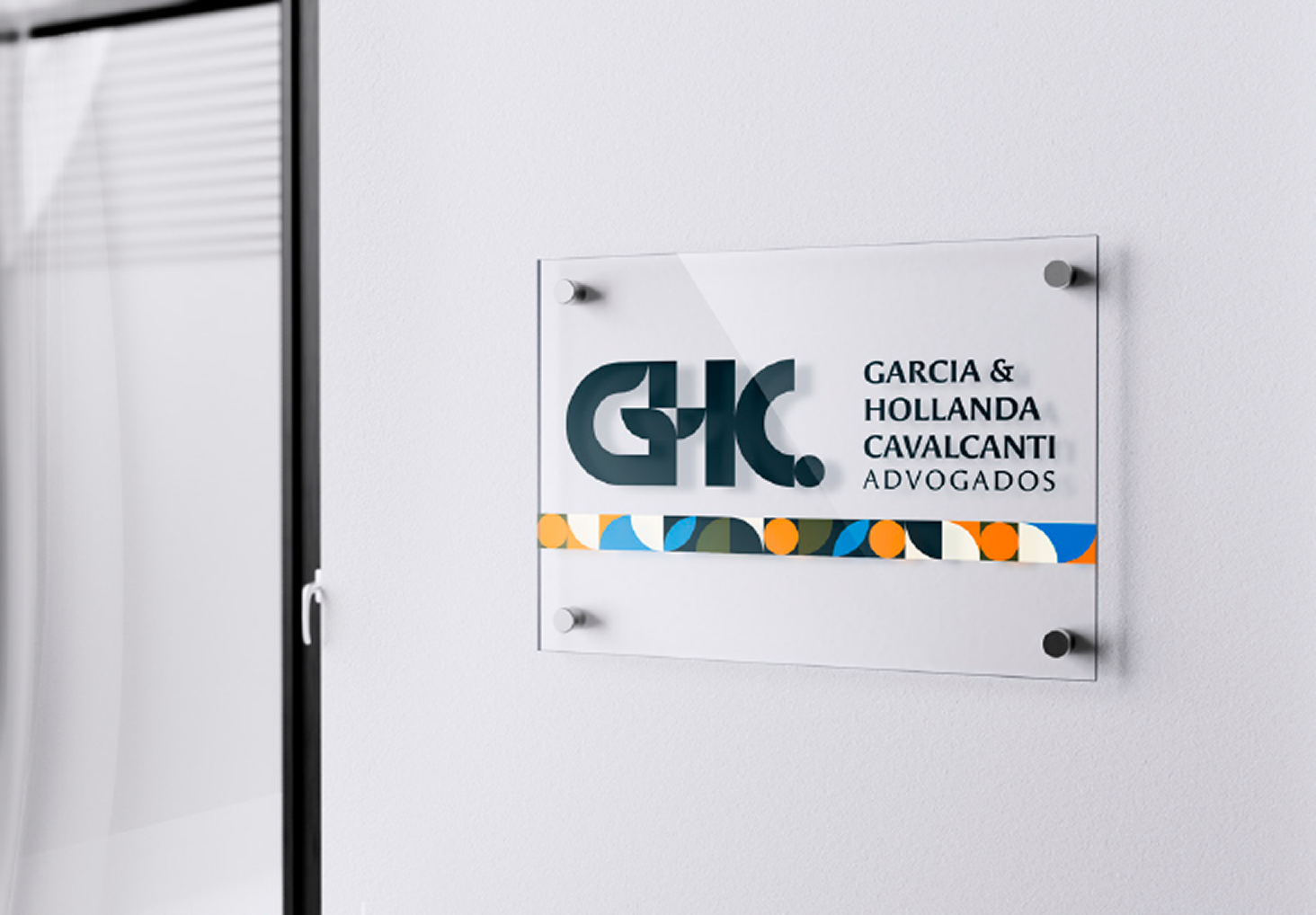Frosted-glass office signage with the GHC monogram